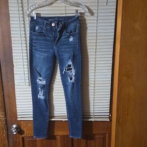 American Eagle Outfitters SuperWomen's Dark Blue Ripped Super Stretch Jegging